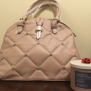 Beautiful Med Size Power Pink Purse/HandBag with Rims stones on the front.